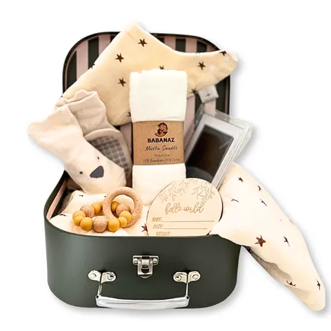 The forest green Babanaz baby gift set packed in its keepsake suitcase
